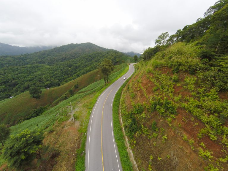 Aerial view of crooked path of road on the mountain, Shot from d